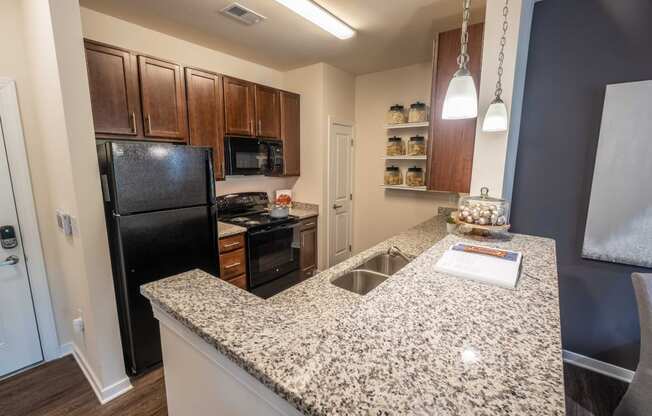 Granite Kitchen Worktops at Abberly CenterPointe Apartment Homes by HHHunt, Midlothian, VA