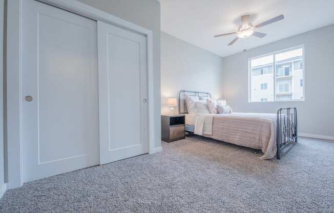 Modern bedroom featuring white oak accents and plenty of closet space