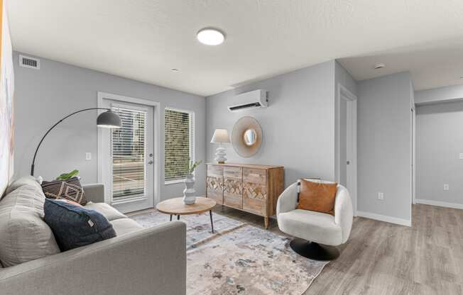 a living room with a couch and a chair