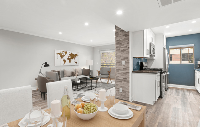Hardwood floored dining room with view of living room and kitchen.