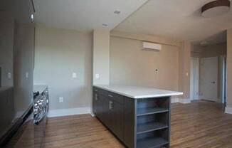 a kitchen with a counter top and a stove