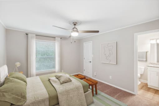 a living room with a couch and a ceiling fan