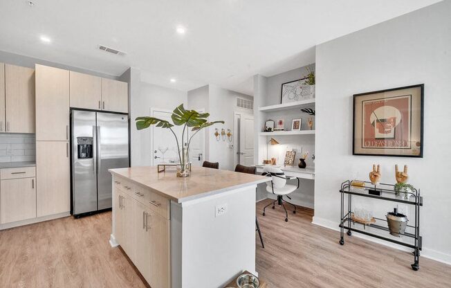 a kitchen with a large island in the middle