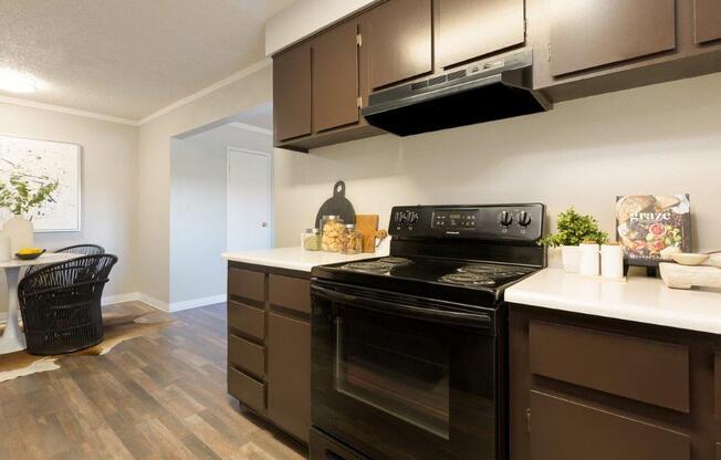 a kitchen with a stove and a microwave