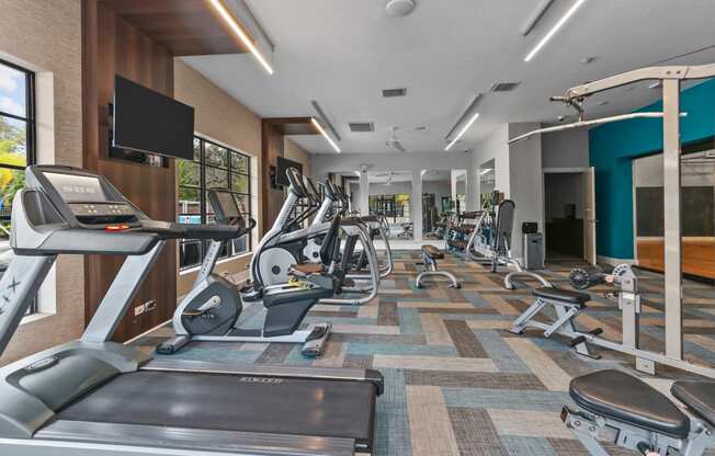 The Preserve at Westchase Apartments fitness center with cardio machines