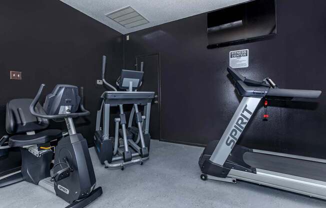 the gym has plenty of exercise equipment in it at The Davis Apartments, Huntsville Alabama  