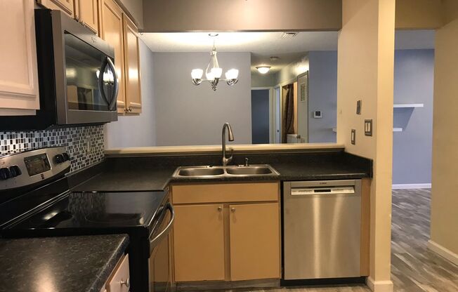 First Level 2 bed Condo Walking distance to Southglen Mall! Utilities included!