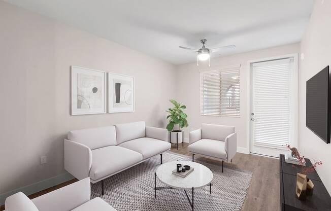 Model living room space with door to patio/balcony