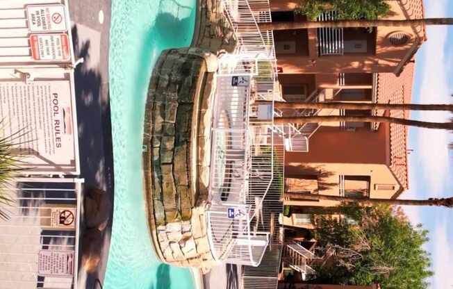 A swimming pool surrounded by buildings.