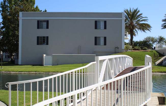 A white building with a white railing and a white staircase.