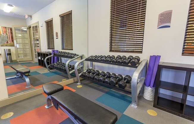 a fitness center with weights and other exercise equipment