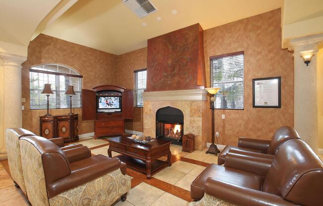 a living room filled with furniture and a fire place sitting in a chair