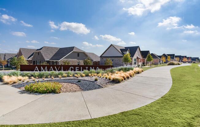 Landscaped pathways and a welcoming community entry set the tone for connected living among thoughtfully designed single-family homes in Celina.