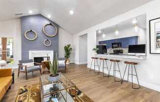 a living room with a bar and a dining room