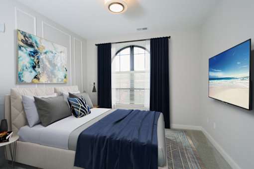 a bedroom with a large bed and a large window at Fairfax, Grandview, OH