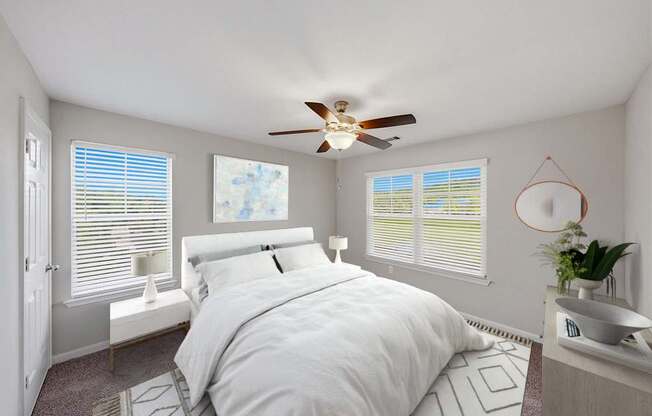 A bedroom with a large bed, expansive windows, and a ceiling fan.