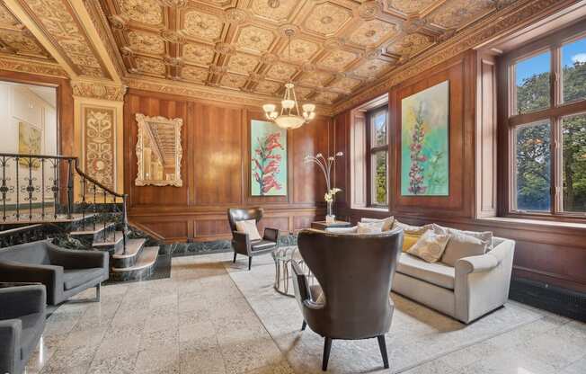 the living room has ornate wood paneling and a marble floor