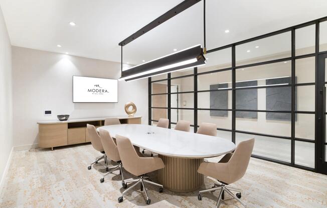 Our community features a modern conference room designed for focused meetings, collaborative work, and everyday productivity at Modera Liberty Row.