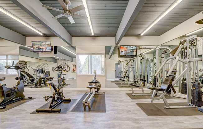 A spacious gym with a variety of exercise equipment.