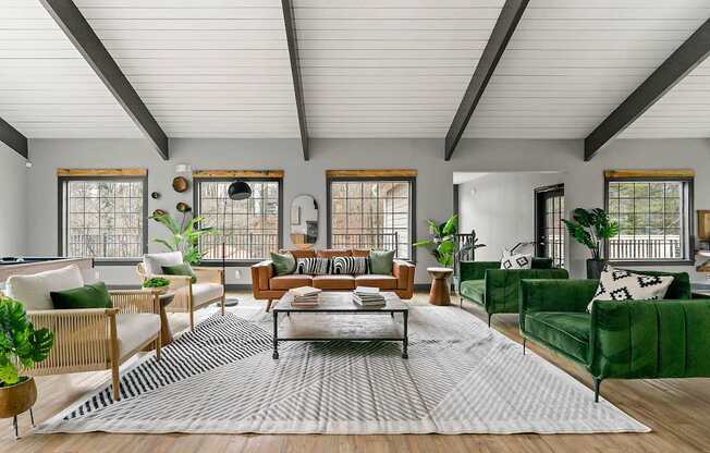 A living room with a green sofa and a coffee table.