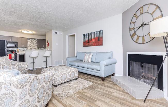 a living room filled with furniture and a flat screen tv