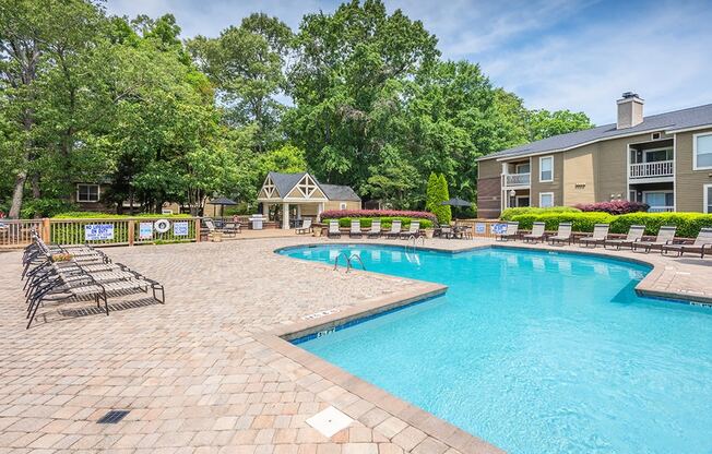 Spacious Pool Sundeck With Brick Pavers & Lounge Chairs