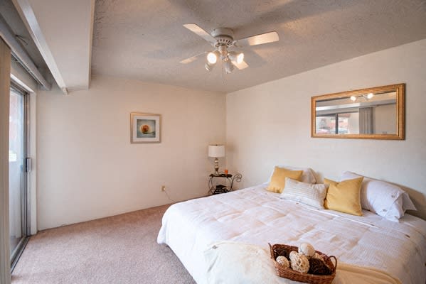 Bedrooms With Lighted Ceiling Fan at Desert Creek, Albuquerque, New Mexico