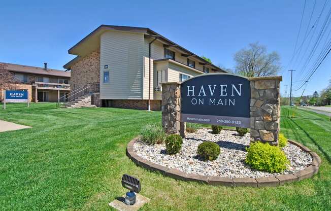 a large sign for heaven on main in front of a building