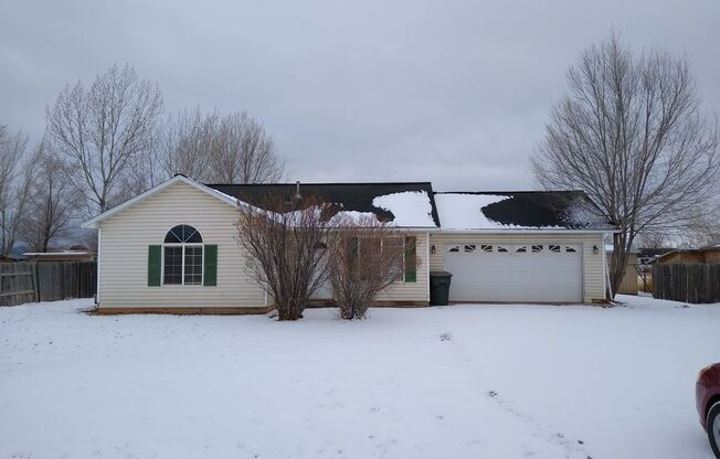 2 Bedroom 1 Bath on 1/2 Acre lot. New Flooring! Fenced yard. Large garage! Horses Allowed.