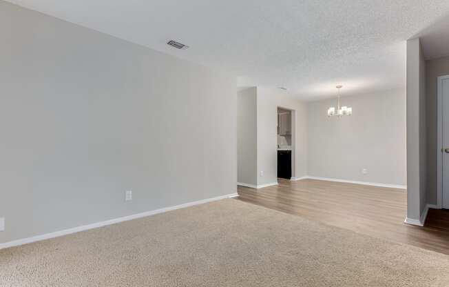 a bedroom with hardwood floors and grey walls