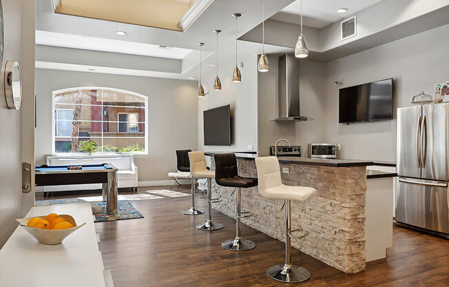 Community Clubhouse with Kitchenette and Pool Table at Reserve at Rancho Belago Apartments in Moreno Valley, CA.