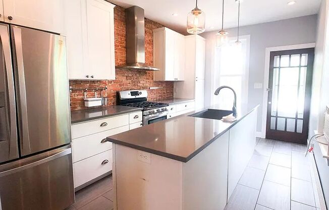 Bright updated 2 bed 1 bath (with heated floors) and private outdoor space!