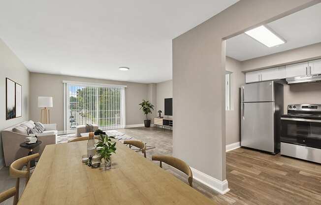 Model Dining Room with Wood-Style Flooring and View of Kitchen at Heights at Marlborough Apartments located in Marlborough, MA.