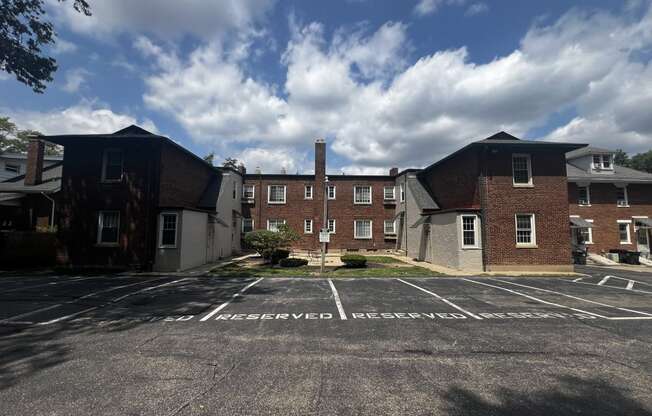 an empty parking lot in front of a brick building  at Cincinnati Premier Living*, Cincinnati, Ohio