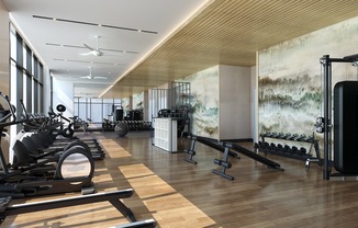 Rooftop club-quality fitness studio with Peloton bikes, TRX system, and a 270-degree view of the Atlanta skyline.
