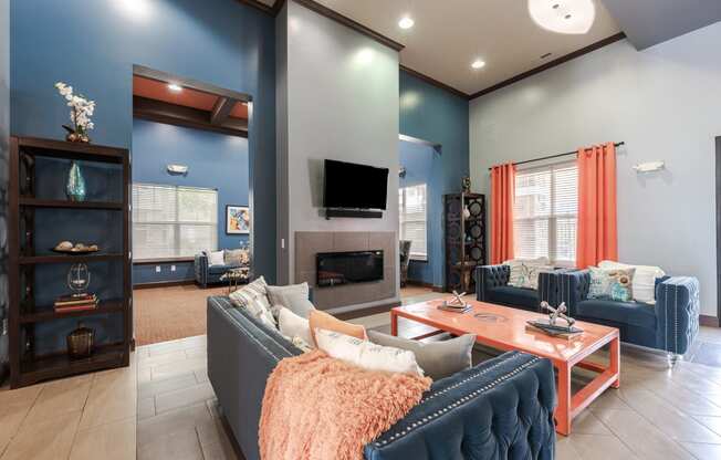 a living room with blue walls and a fireplace