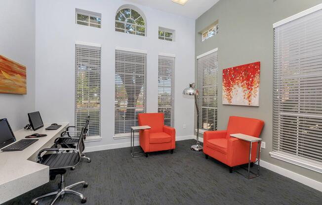 Two red chairs in the community computer room