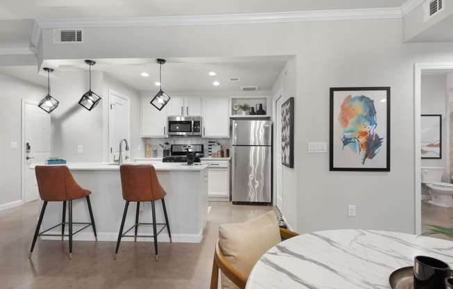 a kitchen and dining area in a 555 waverly unit