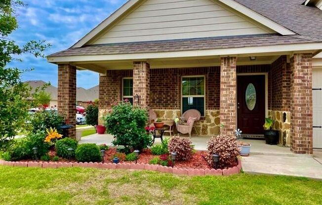 Elegant four‑bedroom corner‑lot home with hardwood floors, modern kitchen, master suite, and community amenities near Hwy I‑20.