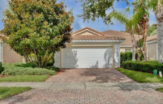 Spacious 3-Bedroom 2 Bath Villa with 2-Car Garage Steps from the Resident Gate in the Prestigious VillageWalk at Lake Nona Community!