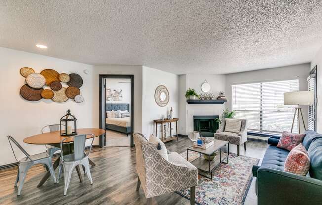 a living room with a couch and a table and a fireplace