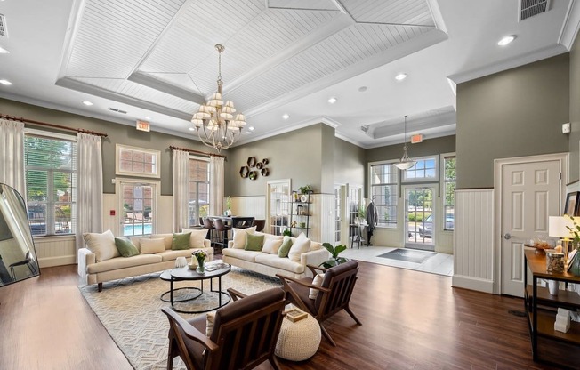 a living room with couches chairs and a coffee table