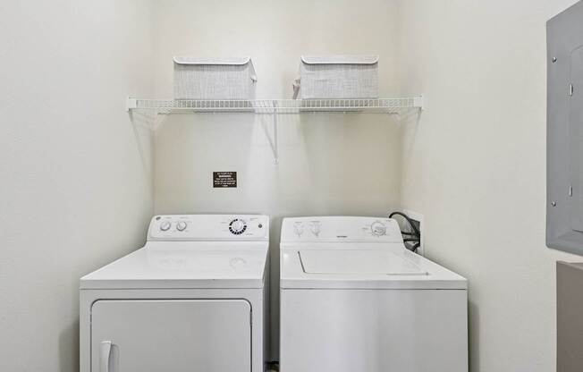 In-unit washer and dryer in a dedicated laundry space at Tattersall Village Apartments in Hinesville