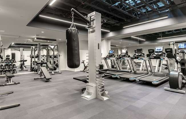 a gym with weights and cardio equipment and a punching bag at The Commonwealth Building, Pittsburgh