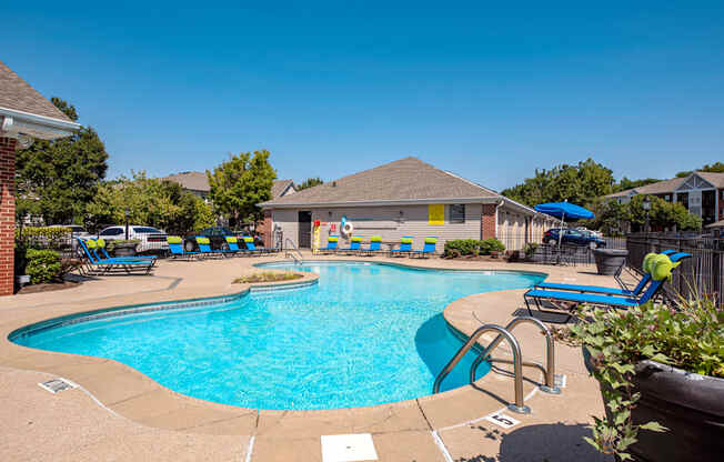 our apartments have a large swimming pool with chaise lounge chairs