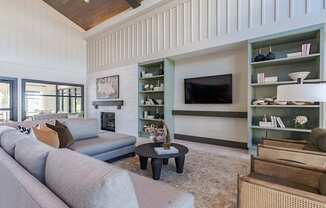 a living room with a couch and a tv