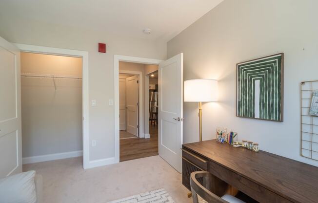 a office with a desk and a closet at Edgebrook Residences, Merrimack