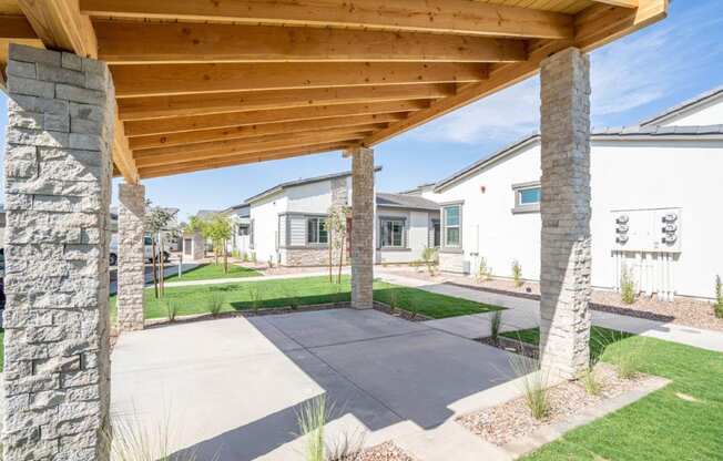 Shaded outdoor lounge area at Village Greens of Queen Creek