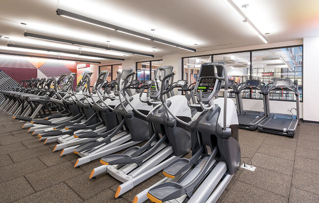 Cardio Balcony at 606 w 57th St Apartments features multiple treadmills and ellipticals. 