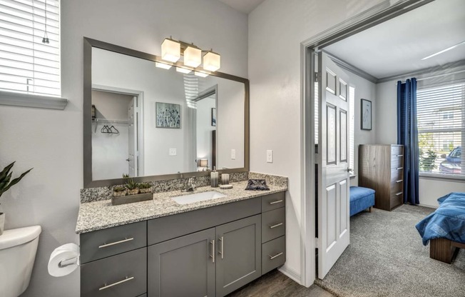 a view of a room with mirrors and counter tops